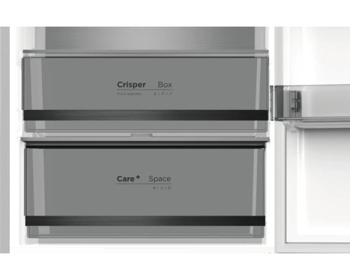 Intérieur d'un réfrigérateur avec bac à légumes et compartiment Care+ Space