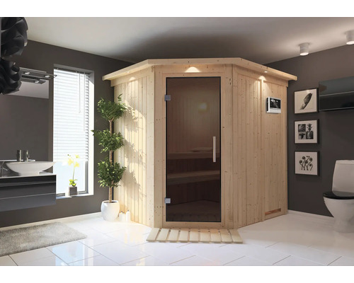 Elementsauna Karibu Petalit inkl. 9 kW Ofen u.ext.Steuerung mit Dachkranz und graphitfarbeneer Ganzglastüre Ecksauna aus Holz mit Glastür in einem Badezimmer
