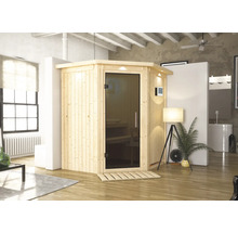 Sauna en bois avec porte en verre dans une pièce lumineuse