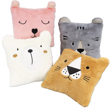 Vier Tierkissen mit Bären-, Katzen- und Löwengesichtern