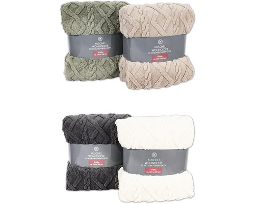 Quatre couvertures douillettes emballées en optique jacquard sherpa, environ 150 sur 200 centimètres.