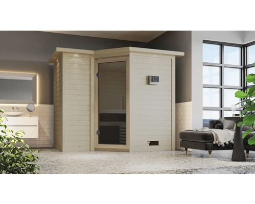 Sauna en bois clair avec porte en verre dans une salle de bains avec lavabo et canapé