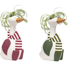 Deux figurines décoratives d'oies avec écharpe et plantes