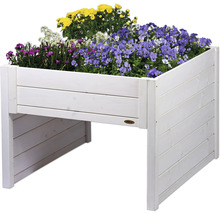 Jardinière surélevée en bois plantée de fleurs