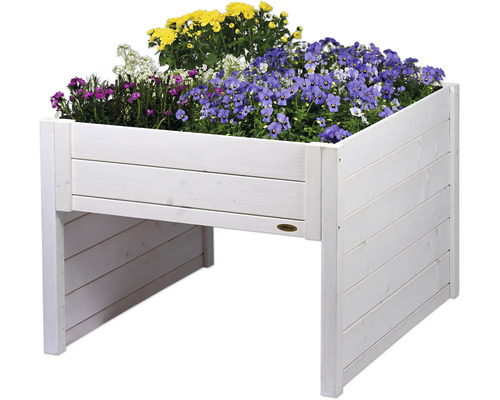 Jardinière surélevée en bois plantée de fleurs