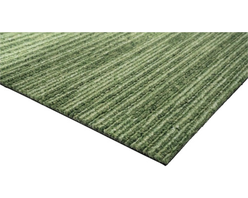 Vue détaillée d'un tapis vert avec un motif structuré.