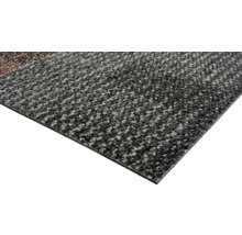 Gros plan d'une dalle de moquette.