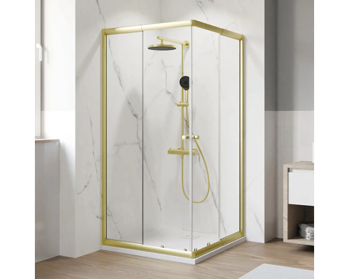 Douche accès d'angle avec porte coulissante BREUER Ektos 80 - 90 cm profilé or mat verre transparent réversible Cabine de douche d'angle avec robinetterie de douche et cadre doré devant un mur blanc