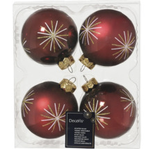 Quatre boules de Noël en verre avec motif d'étoile dans l'emballage
