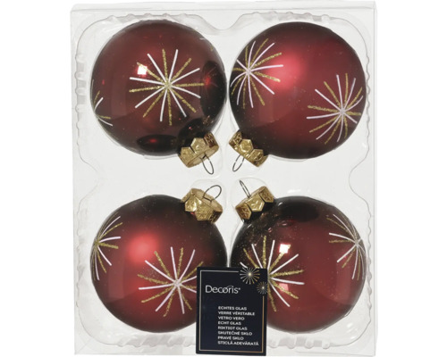 Quatre boules de Noël en verre avec motif d'étoile dans l'emballage