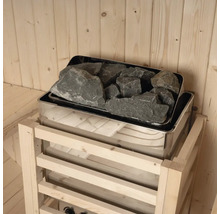 Poêle de sauna avec pierres de sauna dans une cabine en bois