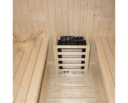 Intérieur de sauna avec bancs en bois et poêle de sauna