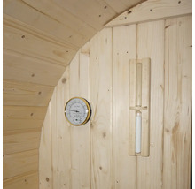 Accessoires de sauna sur un mur en bois : thermomètre et sablier