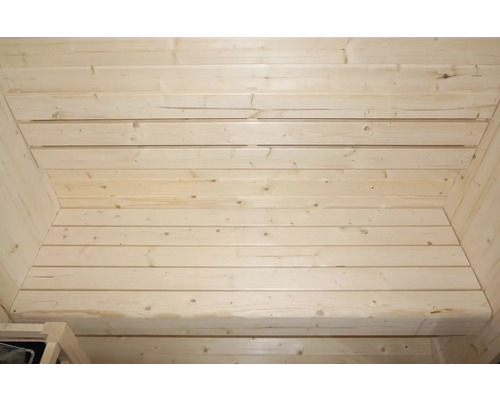 Vue intérieure d'un sauna avec lambris en bois sur les murs et le plafond