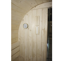 Intérieur d'un sauna avec thermomètre et sablier