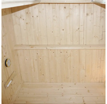 Intérieur d'un sauna avec murs en bois, banc et thermomètre