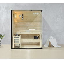 Sauna intérieure avec bancs en bois, poêle de sauna, seau et éléments en verre