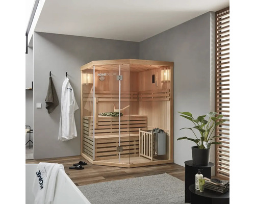 Sauna d'angle avec façade en verre, bancs et poêle de sauna dans une salle de bain