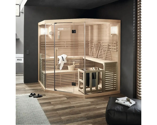 Sauna d'angle avec façade en verre, bancs en bois et poêle de sauna dans une pièce au design moderne
