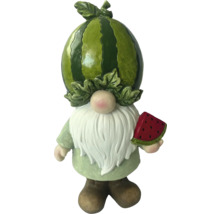 Gartenzwerg mit Wassermelone als Kopf und einer Melone in der Hand