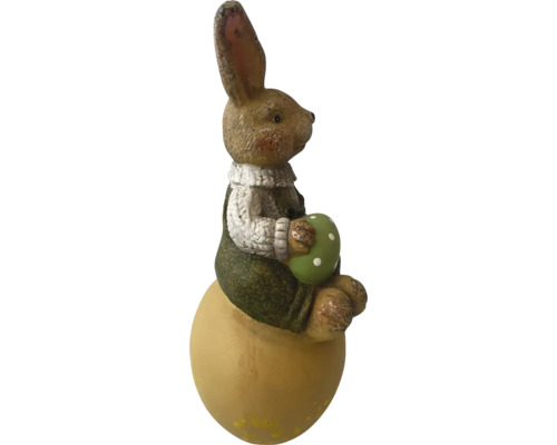 Osterhase auf Ei mit Dekoei