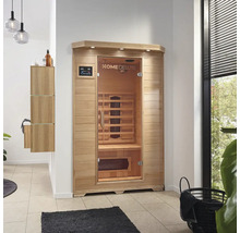 Sauna infrarouge en bois avec porte en verre et panneau de commande numérique dans une pièce lumineuse
