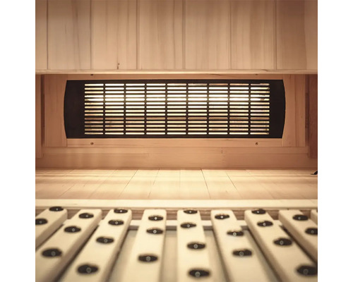 Intérieur d'un sauna avec lambris en bois et grille de ventilation