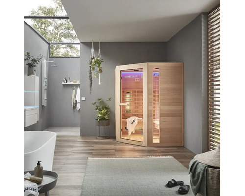 Salle de bains avec sauna infrarouge, baignoire et douche pour des moments de détente