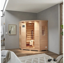 Sauna d'angle en bois avec porte en verre dans une salle de bain
