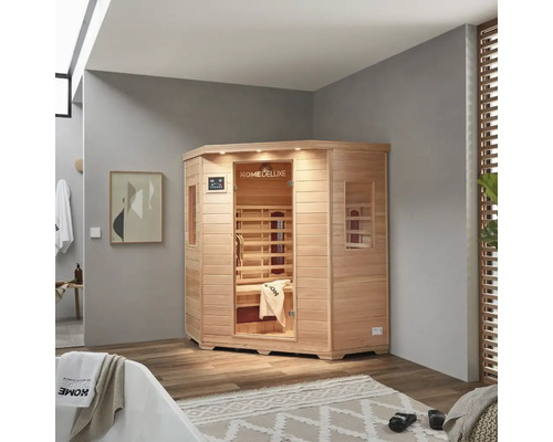 Sauna d'angle en bois avec porte en verre dans une salle de bain