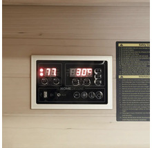 Panneau de commande d'un sauna avec affichage numérique et informations de sécurité