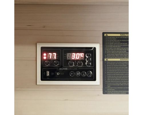 Panneau de commande d'un sauna avec affichage numérique et informations de sécurité