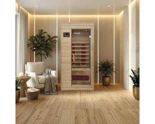 Sauna infrarouge dans une pièce claire et moderne avec plancher en bois et plantes