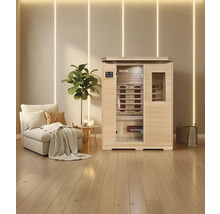 Sauna infrarouge avec banc et radiateurs infrarouges dans une pièce lumineuse avec plancher en bois