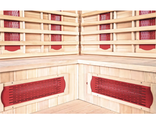 Vue intérieure d'un sauna infrarouge avec des bancs en bois et des panneaux chauffants