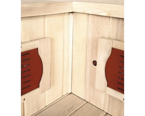 Vue intérieure d'un sauna infrarouge avec des murs en bois et des éléments chauffants