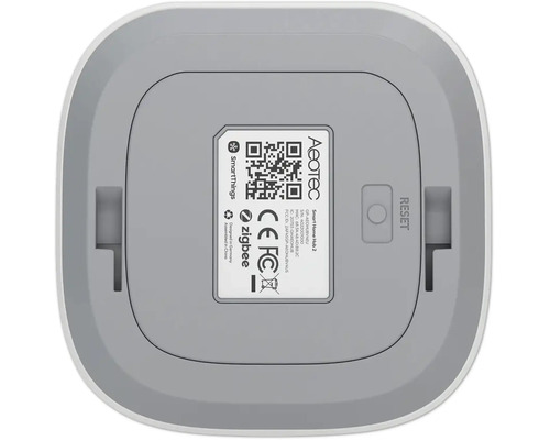Dessous de l'Aeotec Smart Home Hub 2 avec code QR, bouton de réinitialisation, Aeotec Logo, Zigbee Logo et SmartThings Logo.