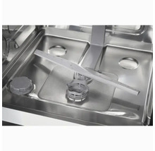 Intérieur d'un lave-vaisselle avec bras d'aspersion et filtre