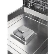 Vue intérieure d'un lave-vaisselle avec compartiment pour produit de nettoyage