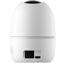 Vue arrière d'une caméra de surveillance blanche avec des connexions