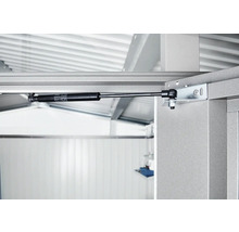 Detailaufnahme eines Gasdruckdämpfers an einem Metallrahmen