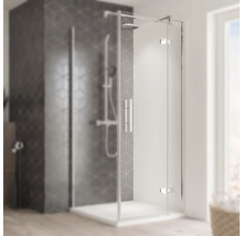 Cabine de douche d'angle avec porte en verre et poignée dans la salle de bain