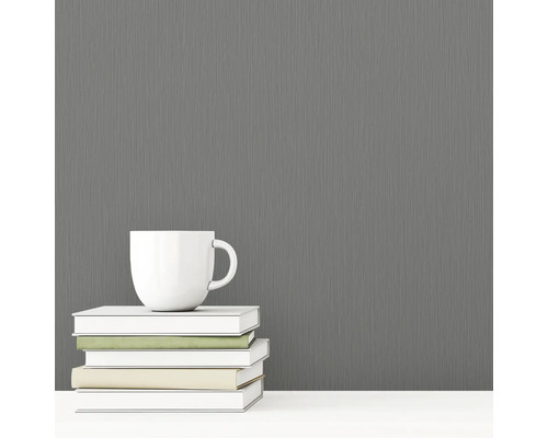 Papier peint intissé gris à structure textile à côté d'une tasse et de livres