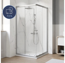 Douche d'angle avec porte coulissante et robinetterie de douche dans la salle de bain