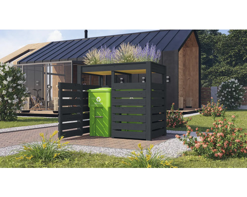 Cache-poubelle en bois avec toit végétalisé et une poubelle verte dans le jardin