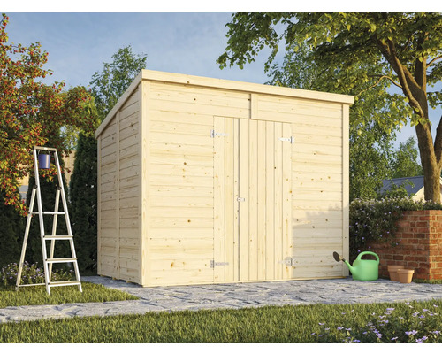 Abri de jardin en bois avec porte et toit à deux pans dans le jardin