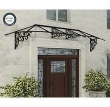 Marquise de porte en métal avec ornements décoratifs au-dessus d'une porte en bois sur un mur en pierre naturelle, symbole de design déposé.