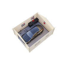 Vue du toit d'un garage avec voiture, vélo et établi