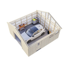 Garage avec voiture, servantes d'atelier et étagères