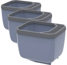 Trois pots de fleurs bleus avec un bord gris en rangée